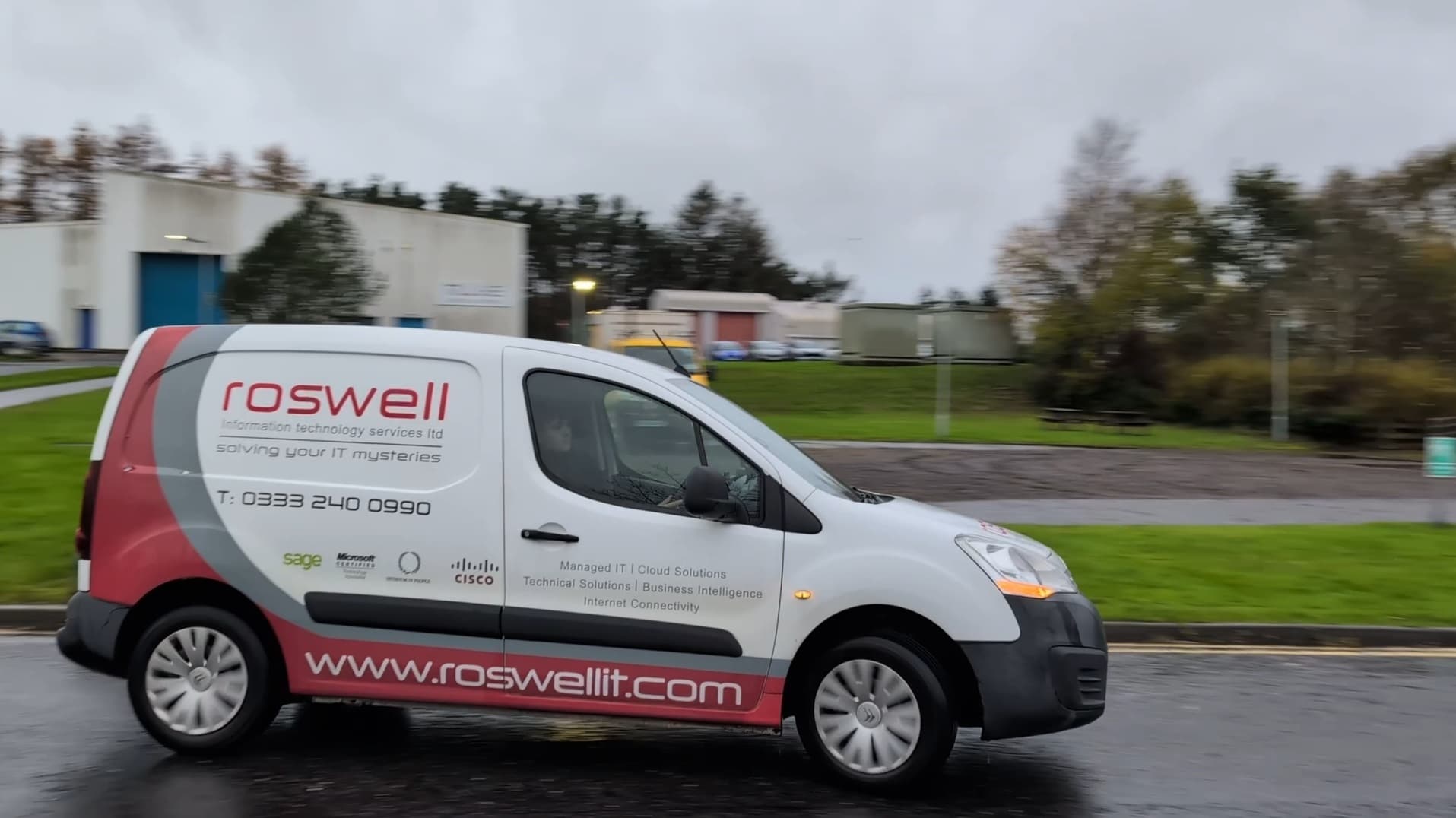 The Roswell IT branded van on the road
